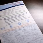 A piece of paper titled Water Urgency Declaration spells out Southern California's water needs and initiative goals, along with signatures from attendees